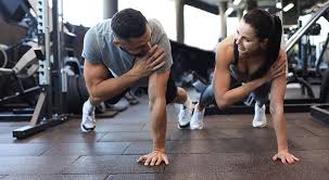 Toning Bingo Wings: Your Ultimate Guide to Sculpting Sleek Arms at the Gym 3 Fitness trainer demonstrating arm toning exercises Bexhill