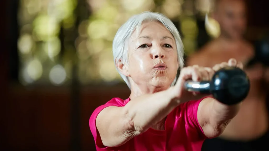 Toning Bingo Wings: Effective Exercises and Tips for Achieving Sleeker Arms 2 Person performing arm exercises with dumbbells Bexhill