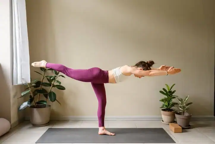 Woman doing Yoga exercise Bexhill to help with toning the body. 