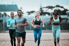 Sculpting Sleek Arms: The Essential Role of Cardio in Toning Without Bulking Up 3 image of people running to incorporate cardio Bexhill exercise into their life to help tone arms and body.